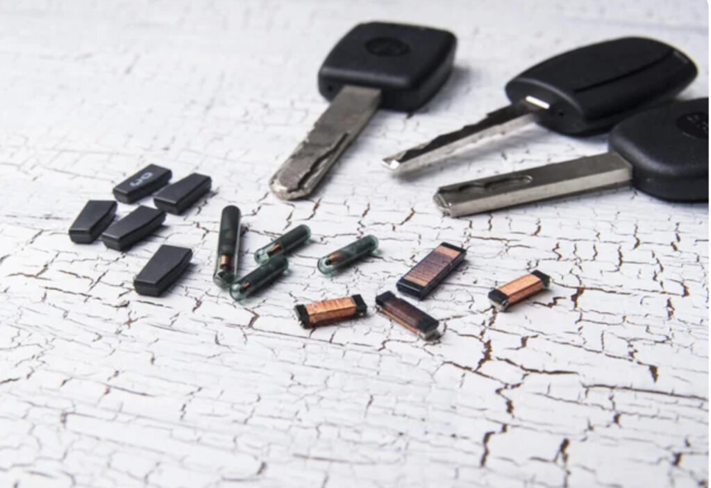 transponder keys and other parts of it on a cracked surface