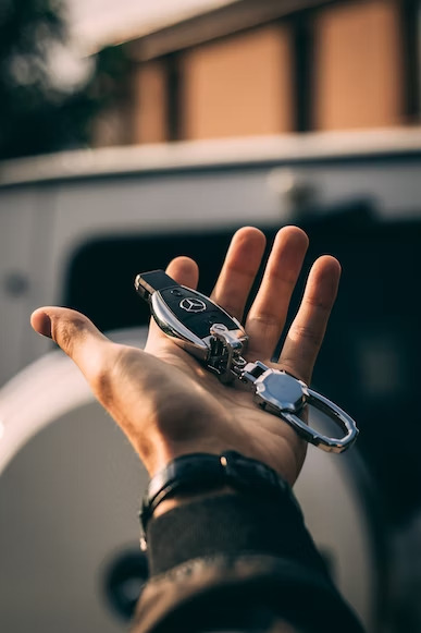 a benz car key in black and silver